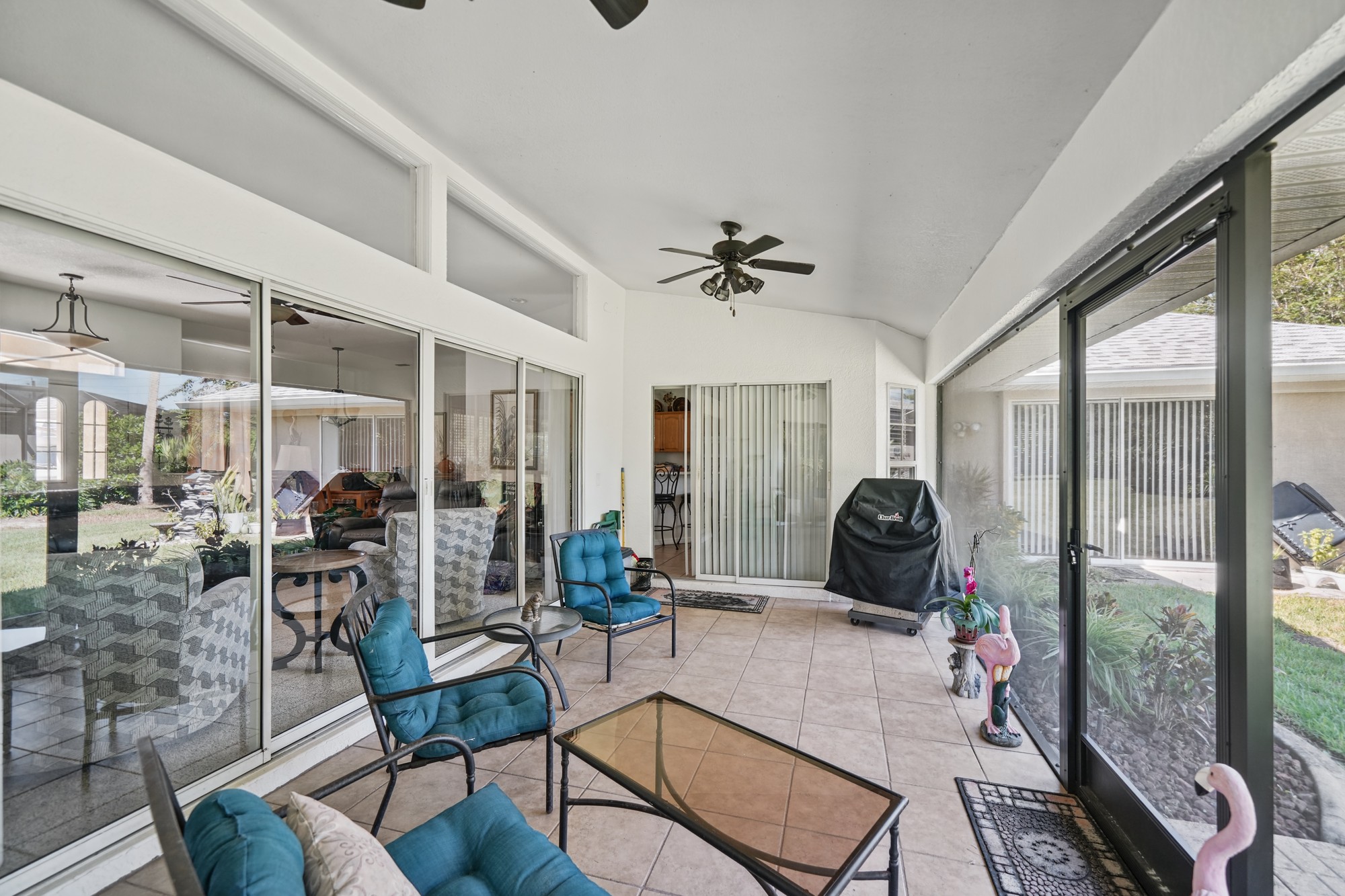 Wide photo of a covered lanai and outdoor living space